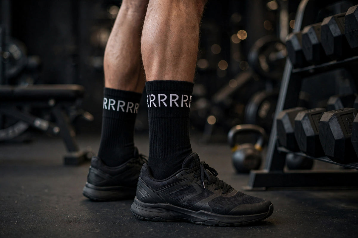 Black crew socks with white R pattern cuff