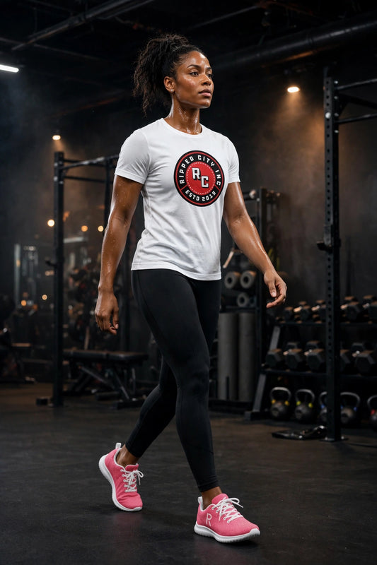 Athletic model in pink Ripped City gym sneakers with white R logo, gym setting