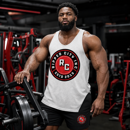 Muscular bodybuilder wearing a coordinated Ripped City logo tank and training shorts outfit - Ripped City Inc premium gym apparel