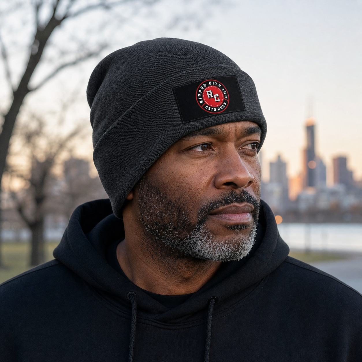 Mature athletic man wearing the Ripped City premium charcoal knit beanie outdoors - Ripped City Inc premium gym apparel